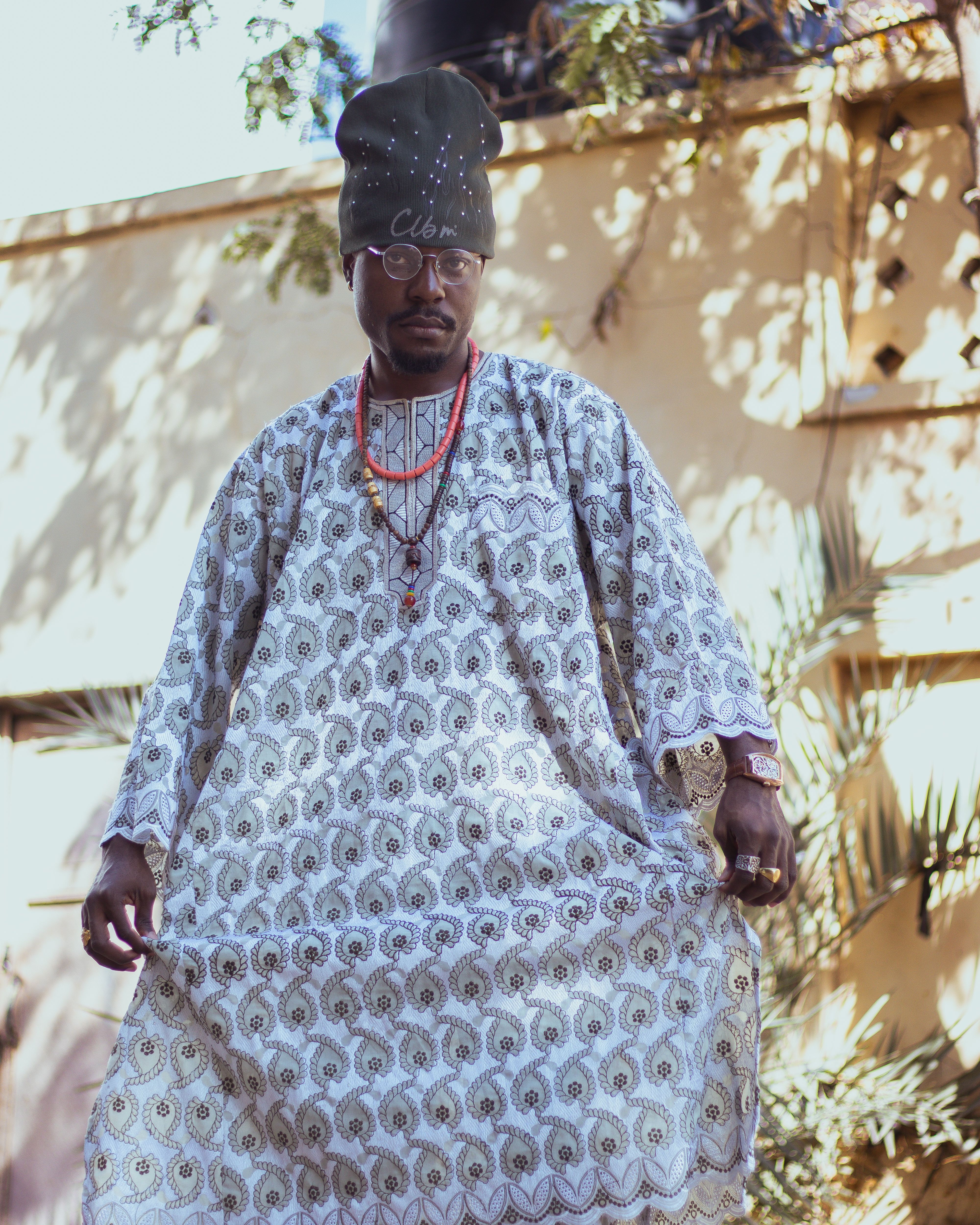 Man wearing traditional Nigerian attire in Kano city, exuding cultural elegance and modern style.