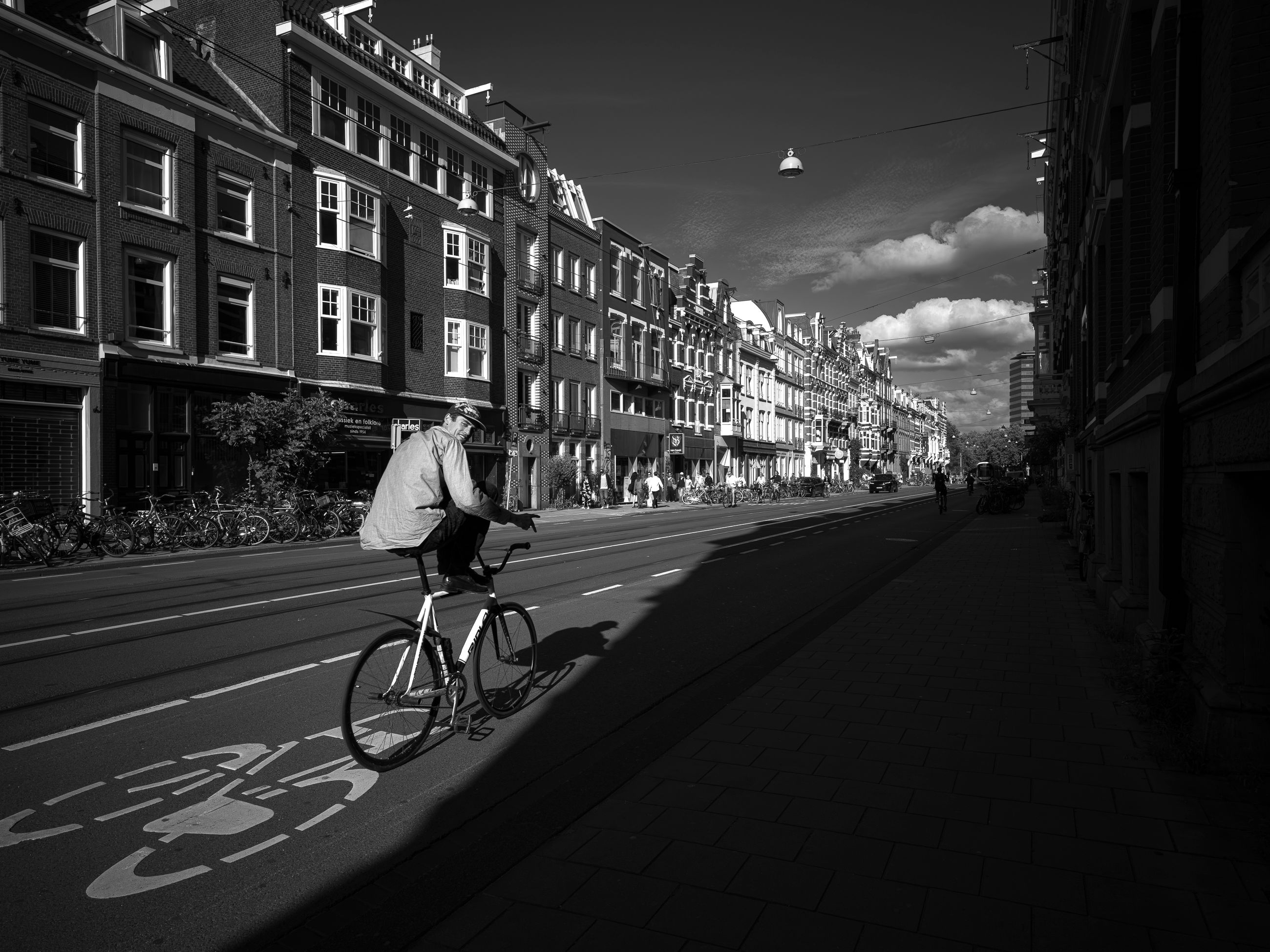Black and white urban street scene with cyclist · Free Stock Photo