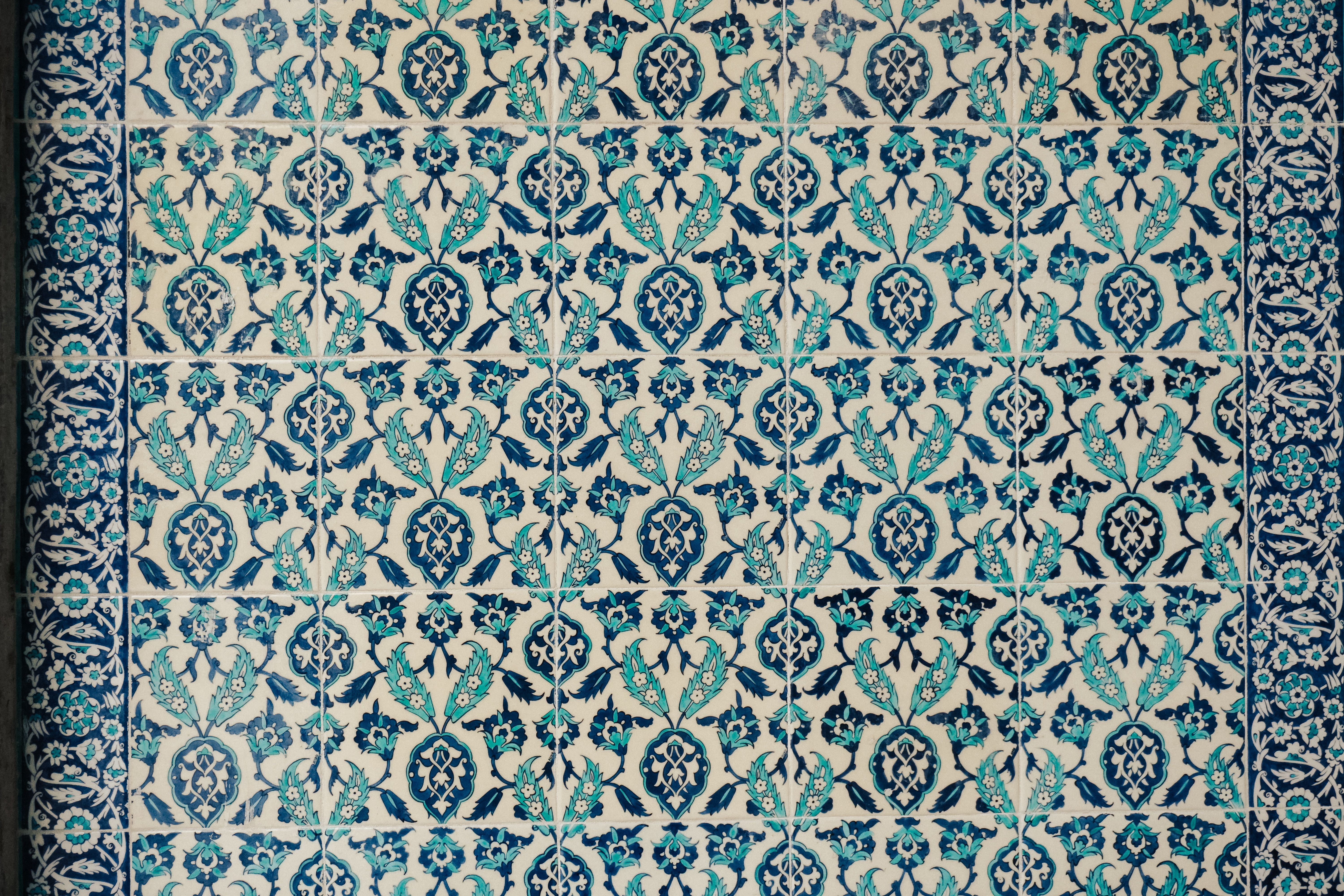 Wallpapering in Eel Pie Island — clean edges cut in around trim and sockets