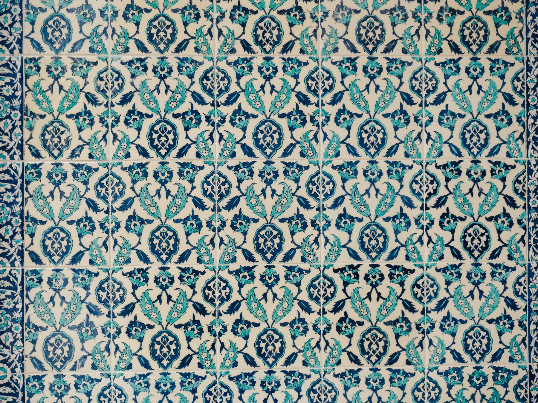 Wallpapering in Eel Pie Island — clean edges cut in around trim and sockets