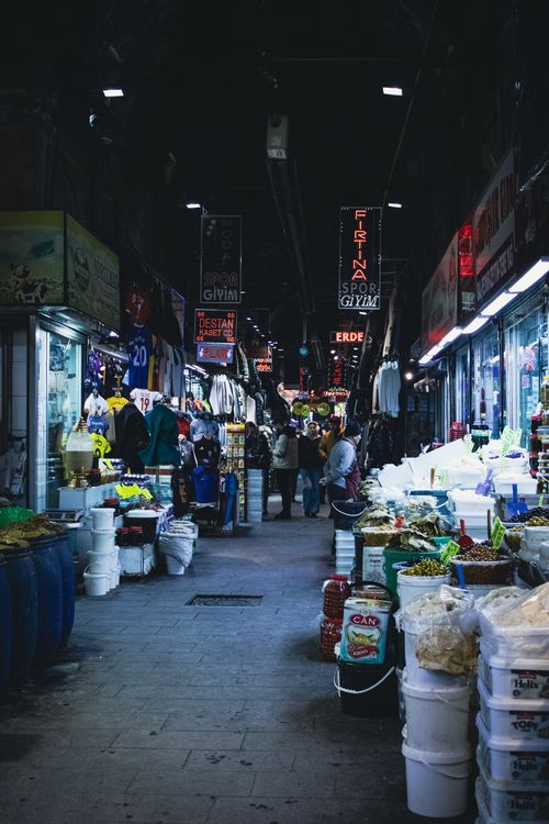 Free Vibrant night market packed with stalls and people exploring various goods. Stock Photo