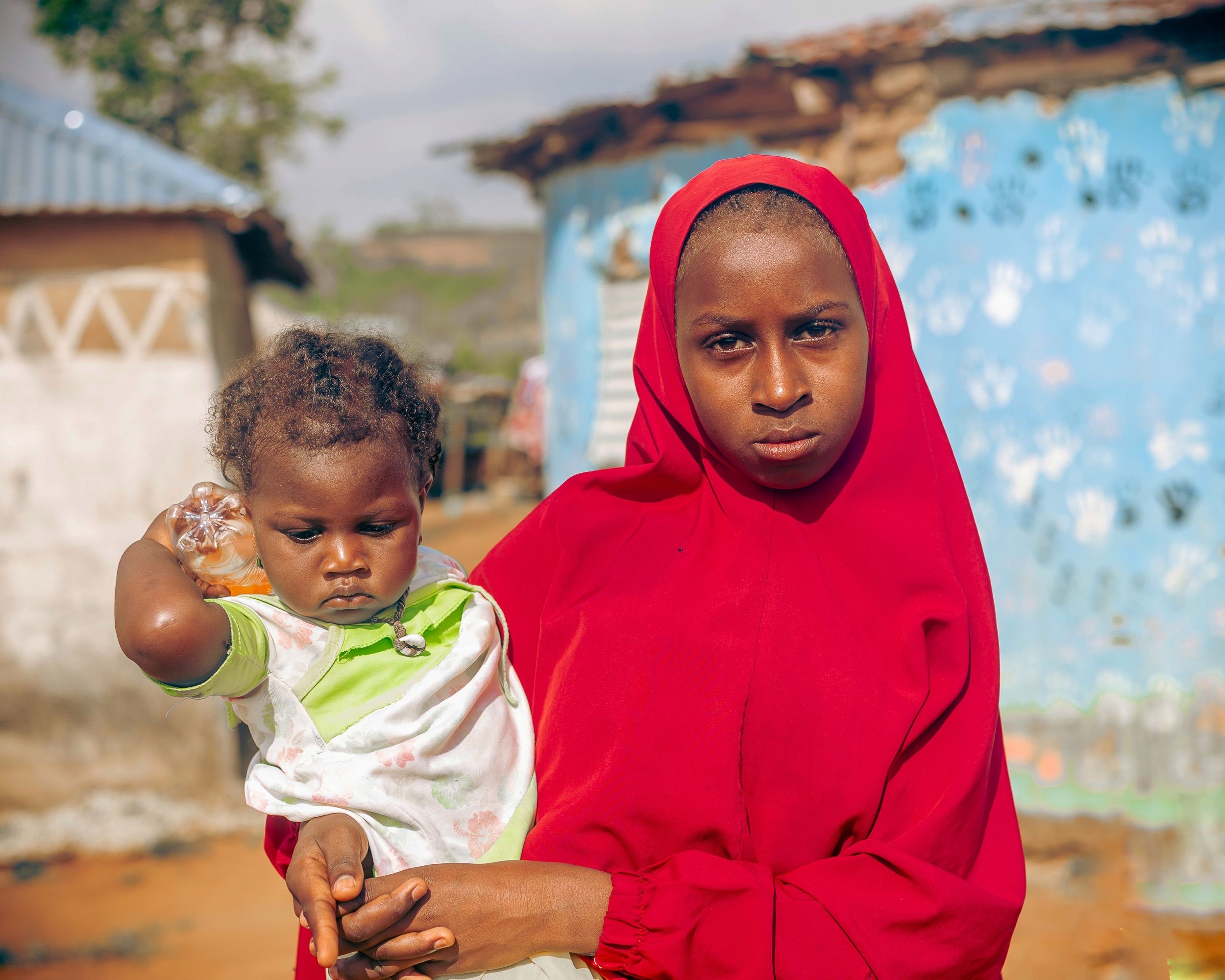 Mother and Child in Colorful Rural Setting · Free Stock Photo
