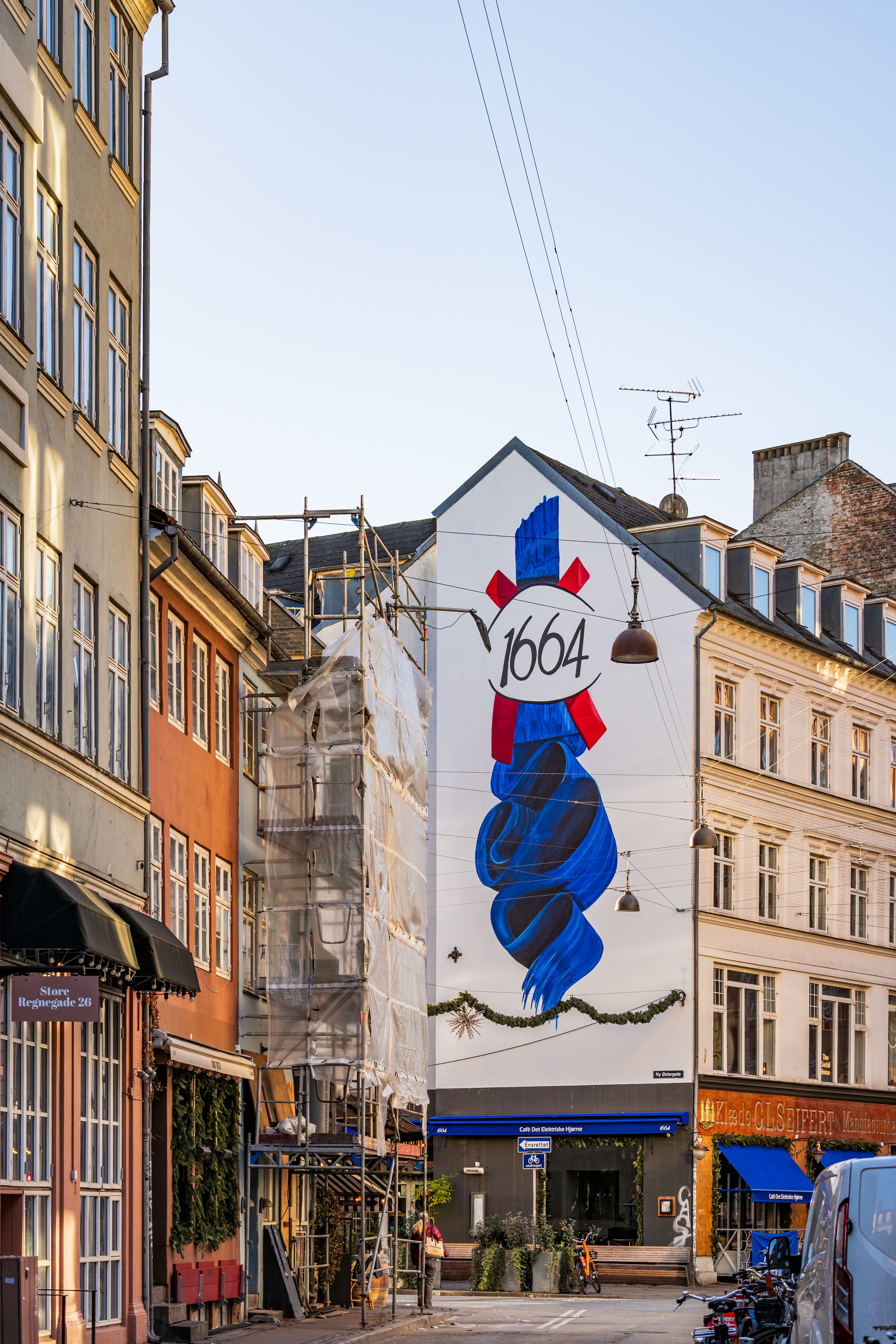 Vibrant mural featuring the 1664 brand adorns a building in Copenhagen, Denmark.