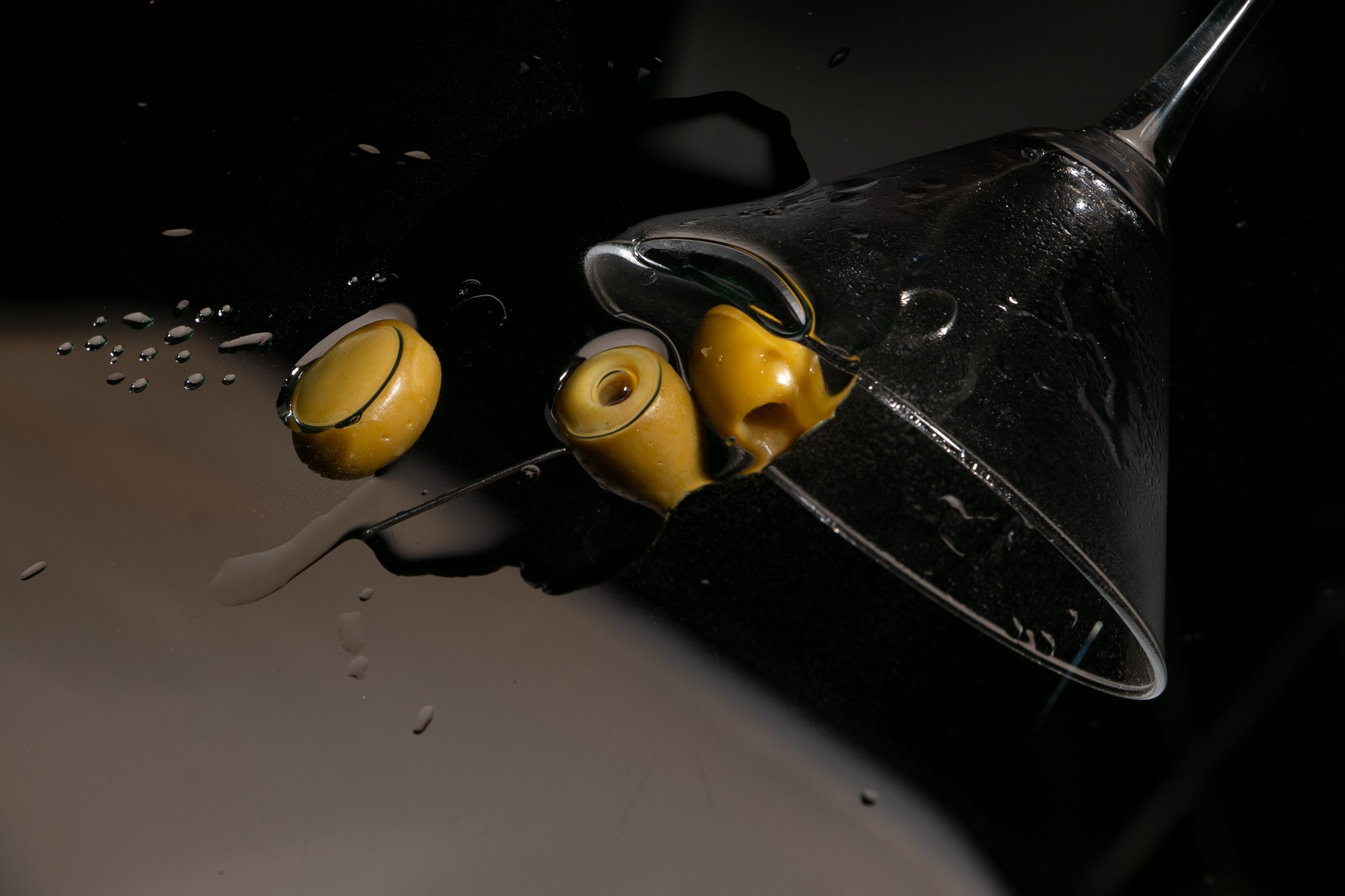 Dark-themed party table with cocktails featuring black vodka