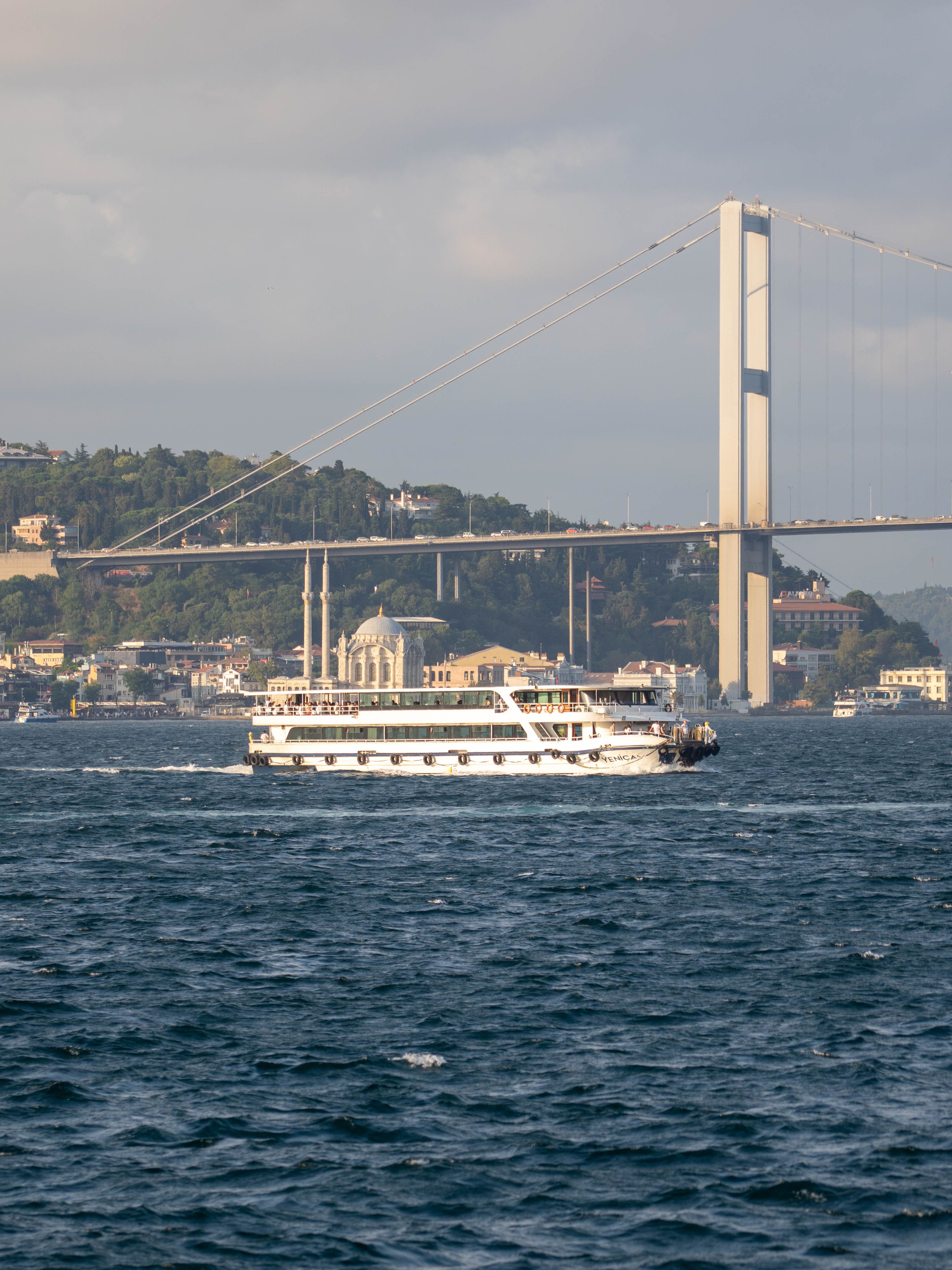 Free Ferry cruising on the Bosporus with scenic bridge view in Istanbul Stock Photo