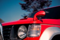 Red Mitsubishi Pajero SUV Detail in Sunlight