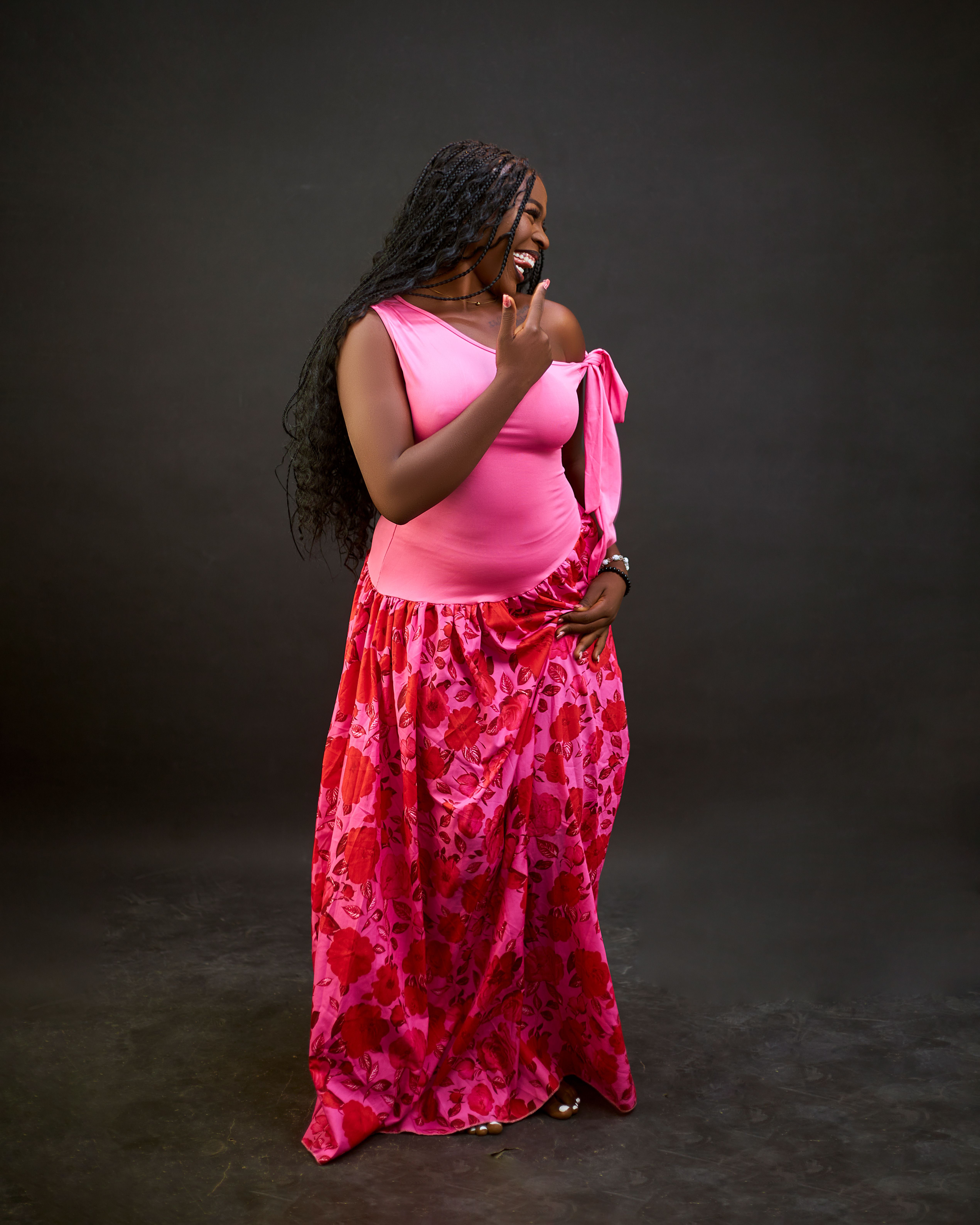 Joyful Woman in Pink Dress Posing in Studio · Free Stock Photo