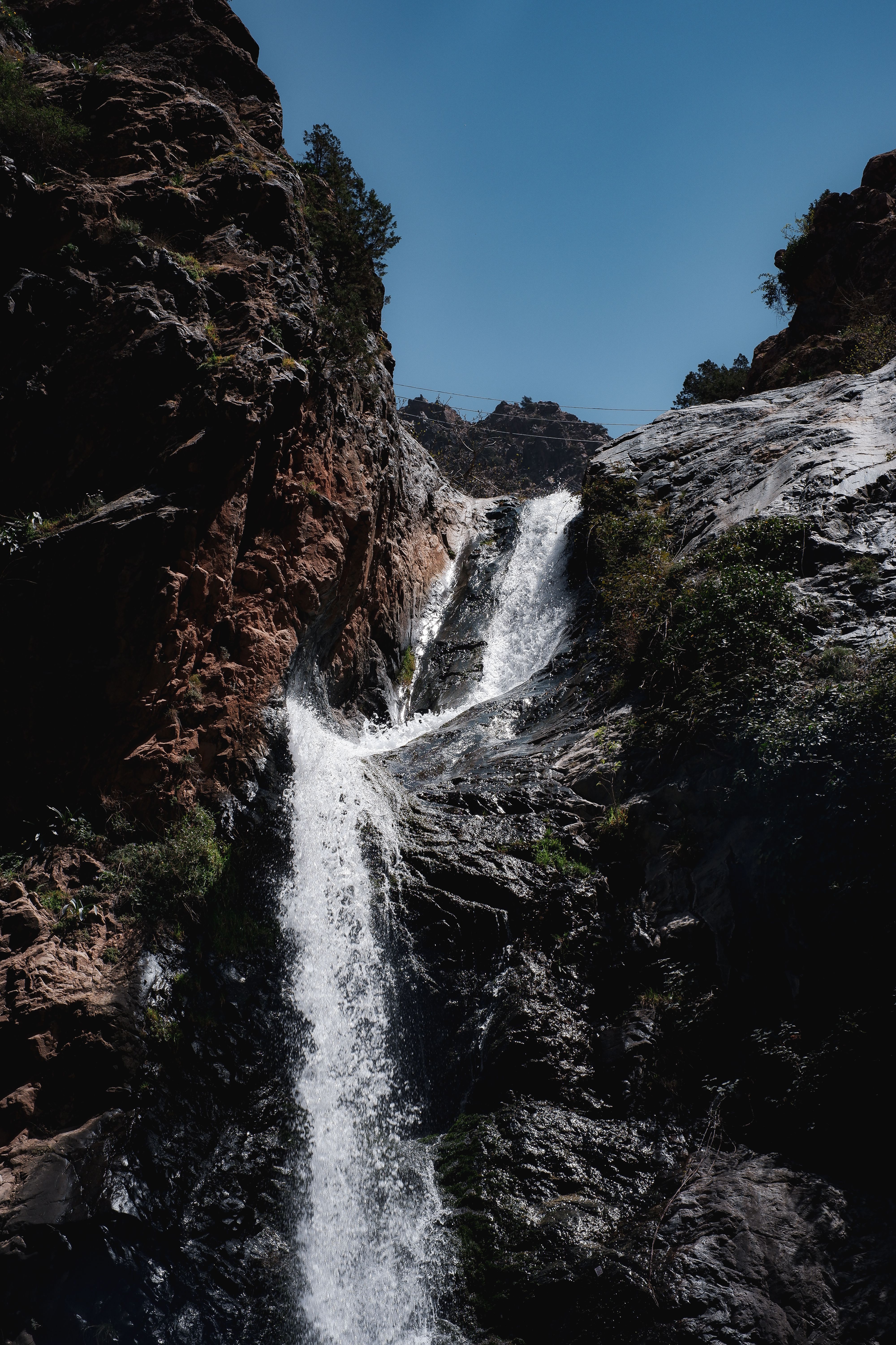 Majestic Waterfall Cascading Down Rocky Cliff · Free Stock Photo