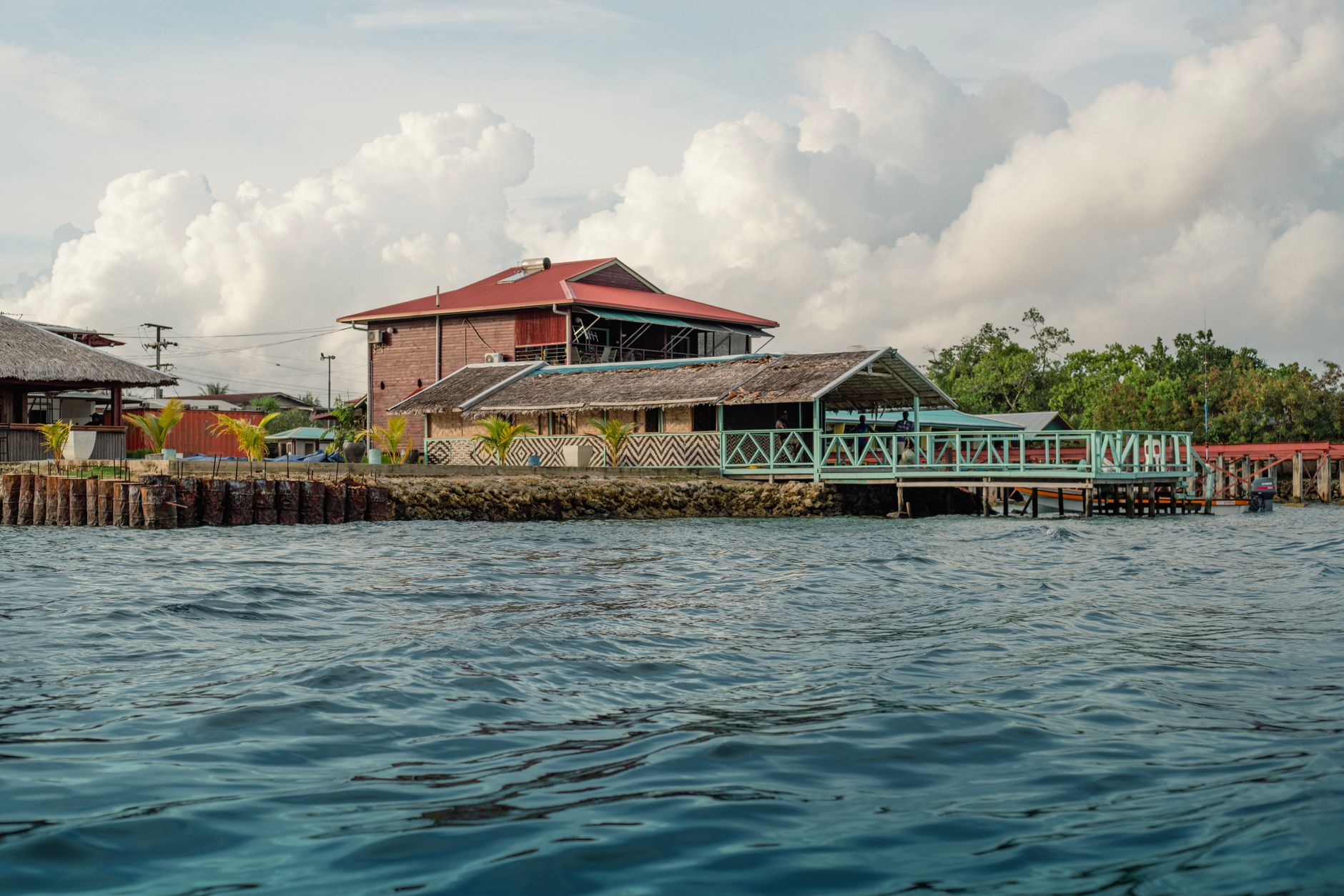 Charming waterfront lodge in Bougainville, Papua New Guinea, surrounded by lush scenery and peaceful waters.