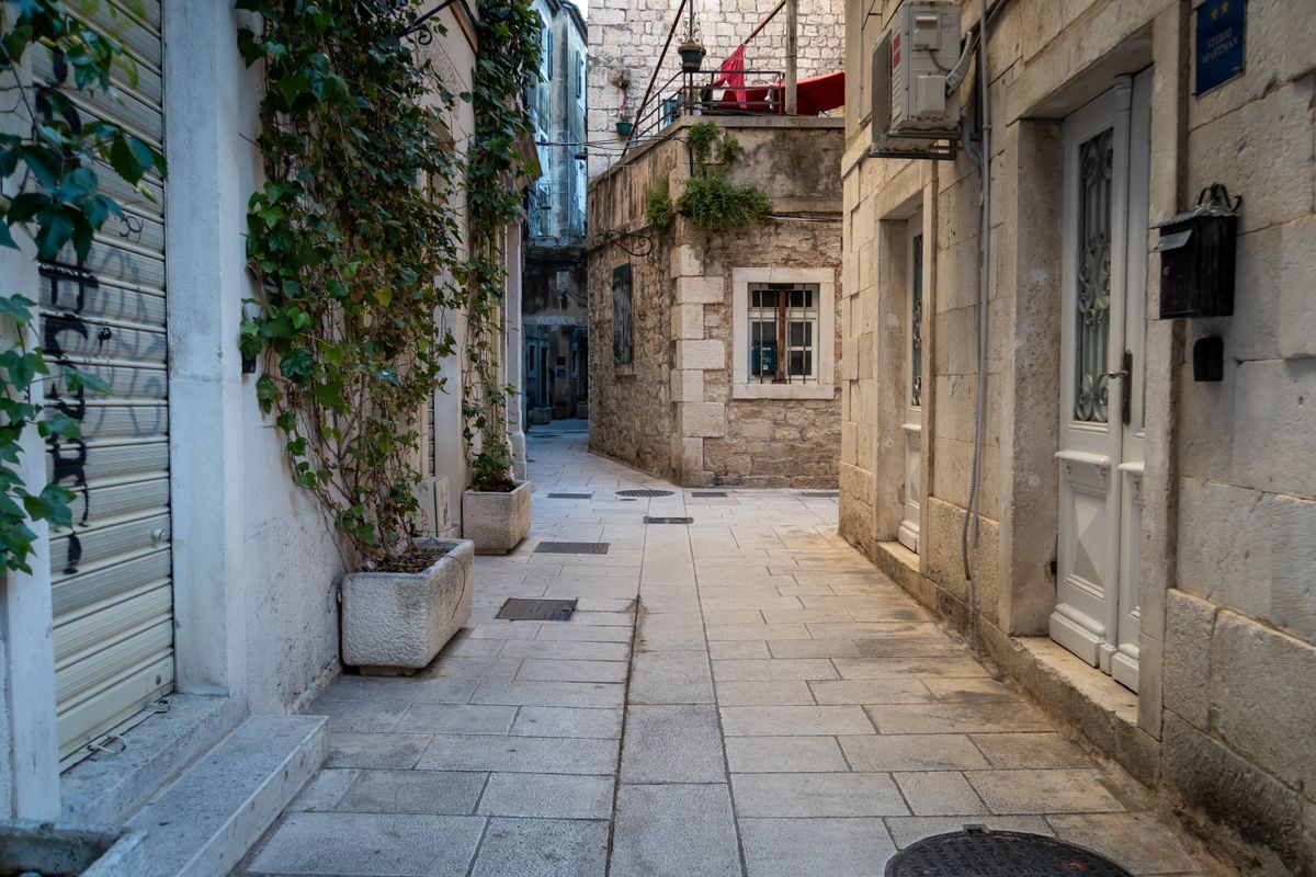 A narrow medieval stone alley in the old town of Split
