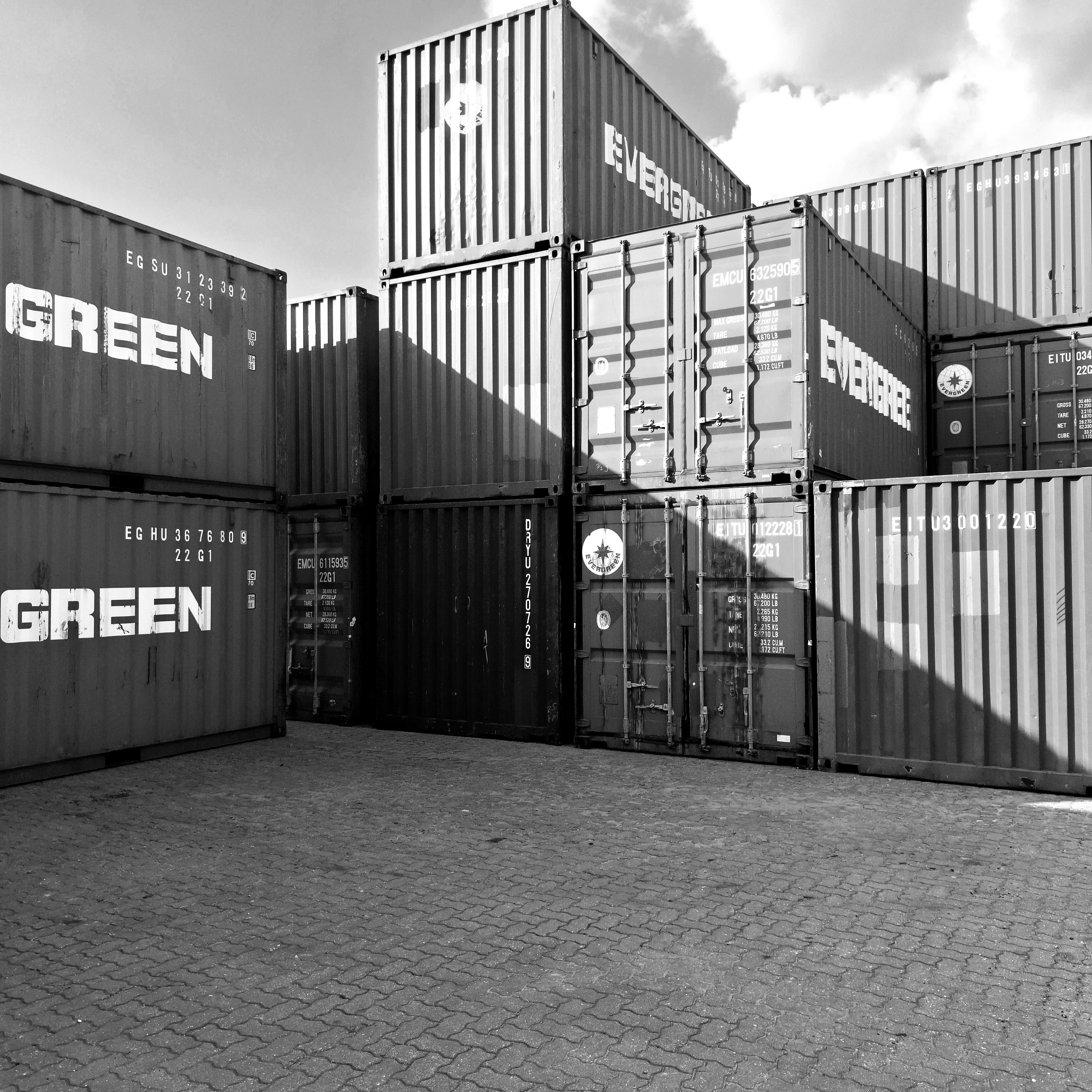 Black and white photo of stacked shipping containers in Ipoh, Malaysia.