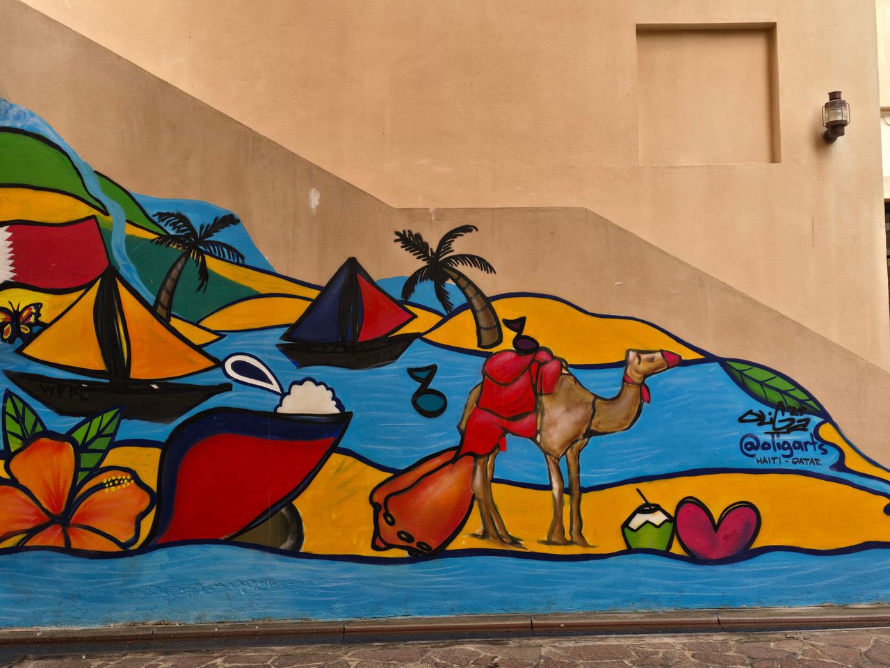 vibrant street art mural depicting a camel boats and tropical motifs