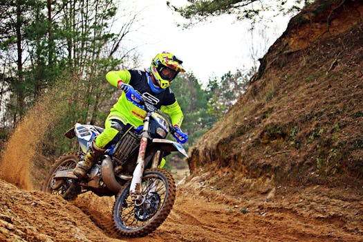 Exciting motocross action shot of a biker speeding through a forest trail, showcasing skill and intensity.