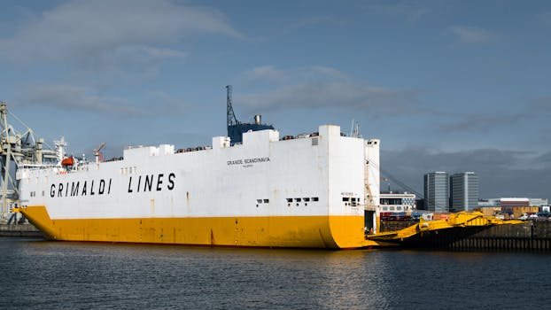 Grimaldi Lines cargo ship docked at Hamburg harbor, showcasing marine industry strength.