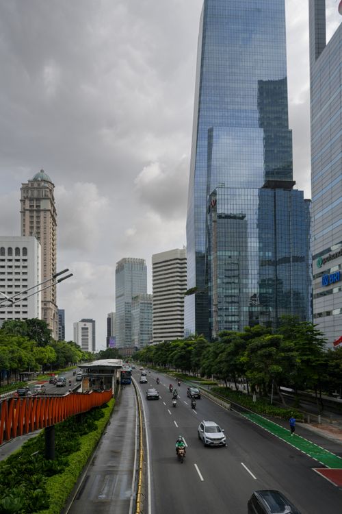 Free A bustling view of Jakarta's financial district, highlighting modern skyscrapers and busy traffic. Stock Photo