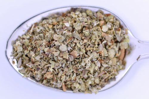 Free Detailed image of marjoram seasoning in a metal teaspoon, perfect for culinary uses. Stock Photo