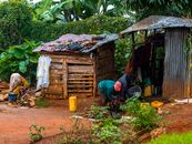 A glimpse into daily village life in rural Africa with people engaged in local activities.