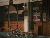 Vintage-style Korean cafe in Seoul with a bicycle parked outside.