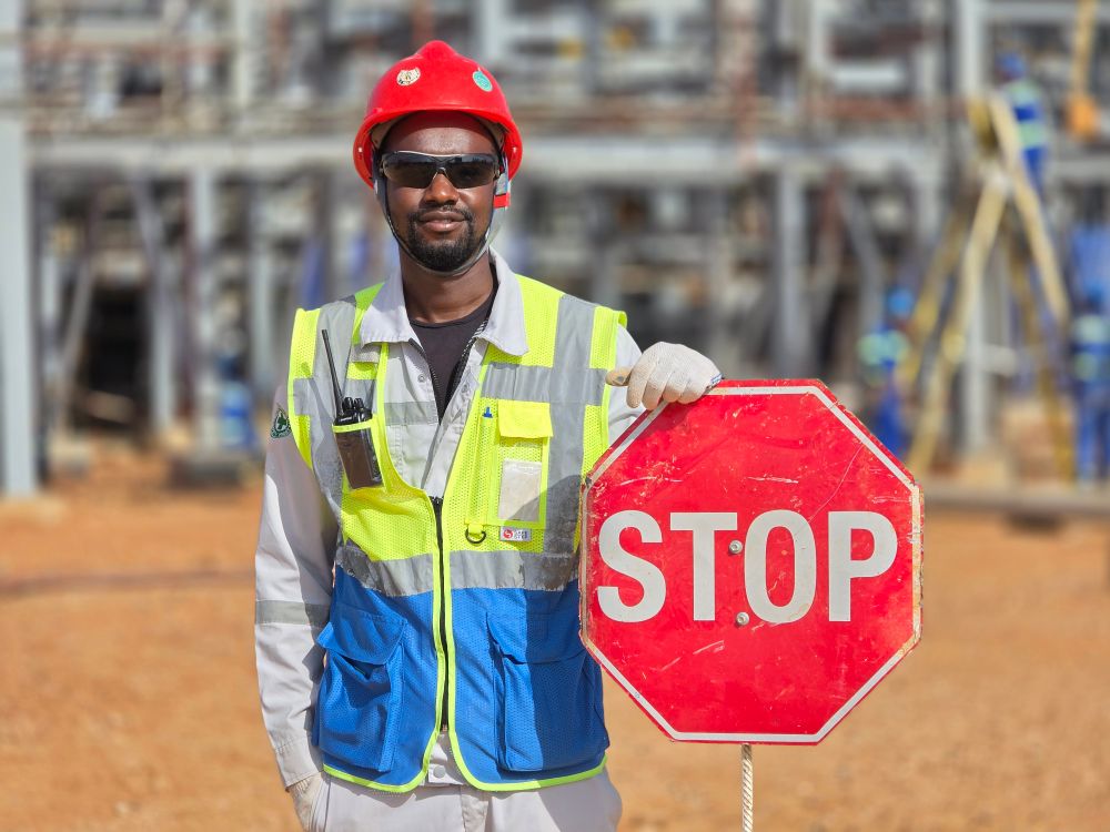 Avoid. Sign Workers Construction Worker Holding Stop Sign at Site · Free Stock Photo