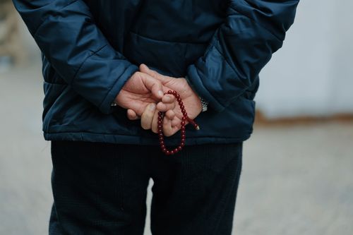 Free Adult with prayer beads behind his back in Ankara, conveying a sense of contemplation and tradition. Stock Photo