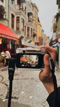 A camera captures the vibrant streets of İstanbul with historic architecture in view.