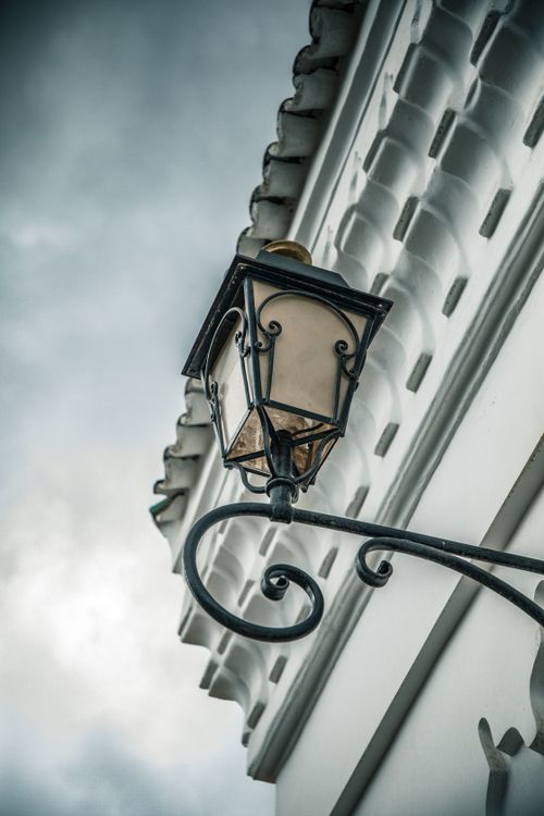 Free A decorative lantern on a traditional Moroccan building in Marrakesh. Stock Photo