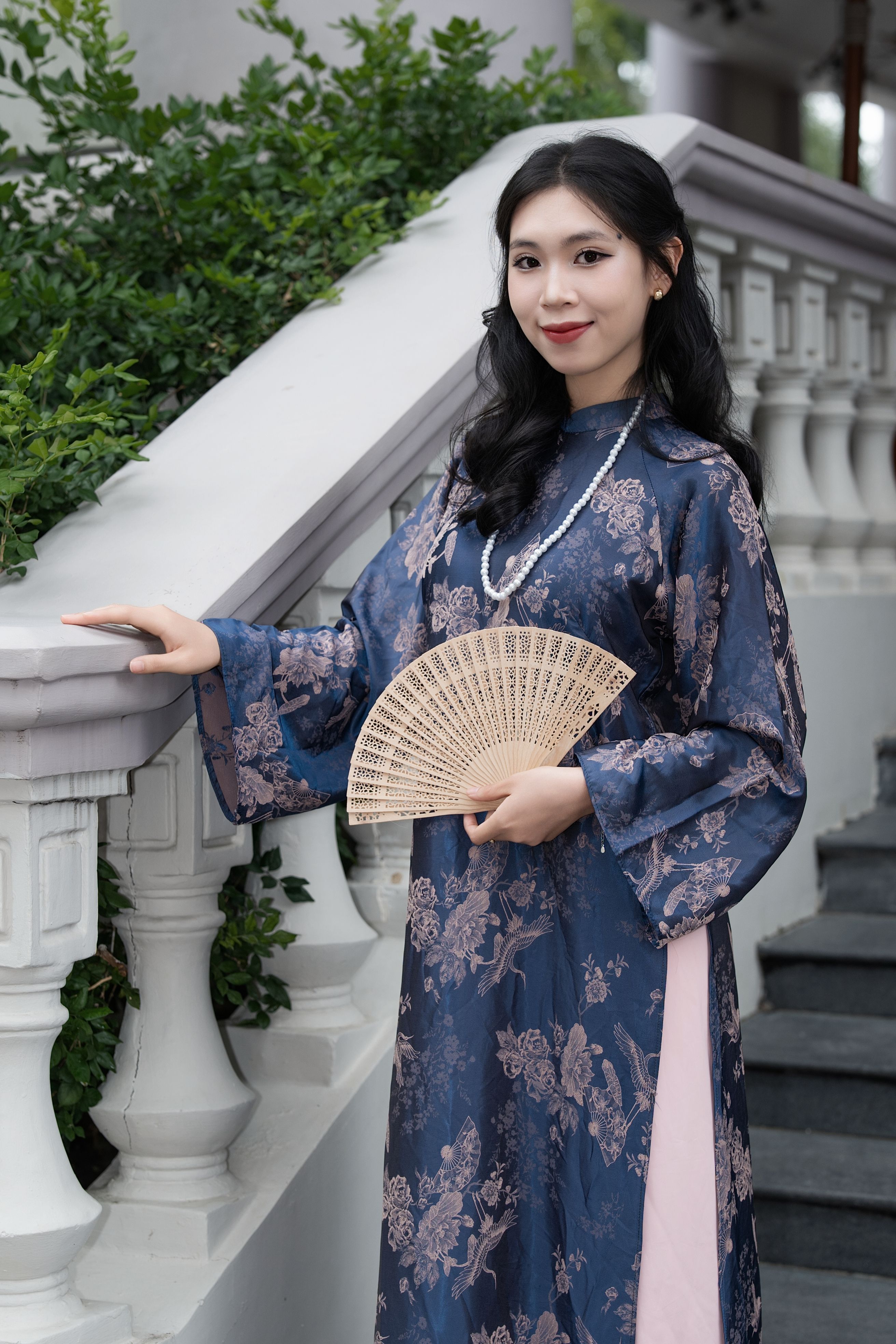 Elegant Woman in Traditional Dress Seated Indoors · Free Stock Photo