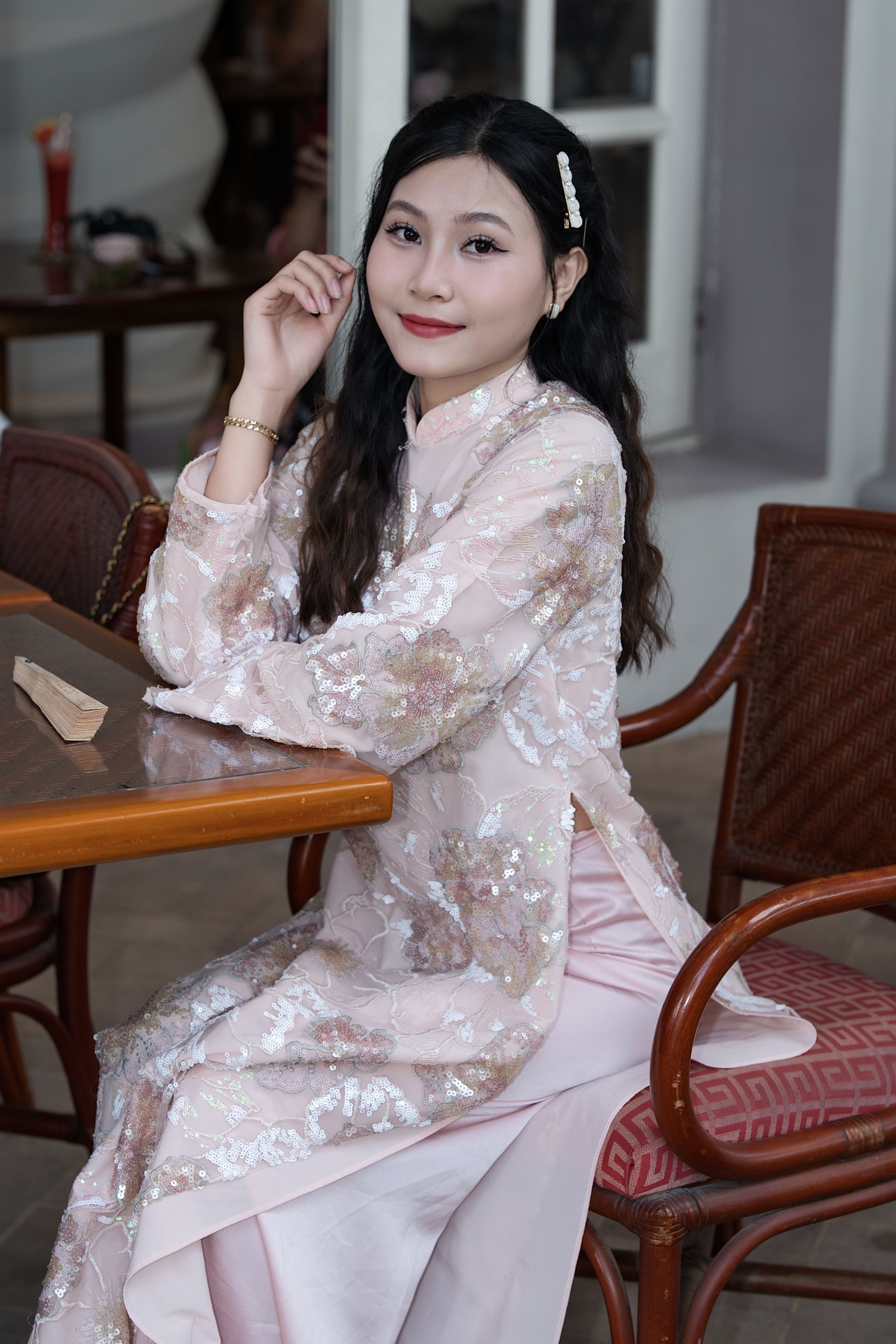 Elegant Woman in Traditional Pink Dress Indoors · Free Stock Photo