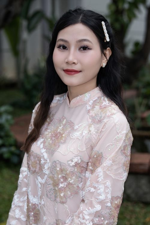 Elegant Woman in Floral Traditional Dress Outdoors · Free Stock Photo