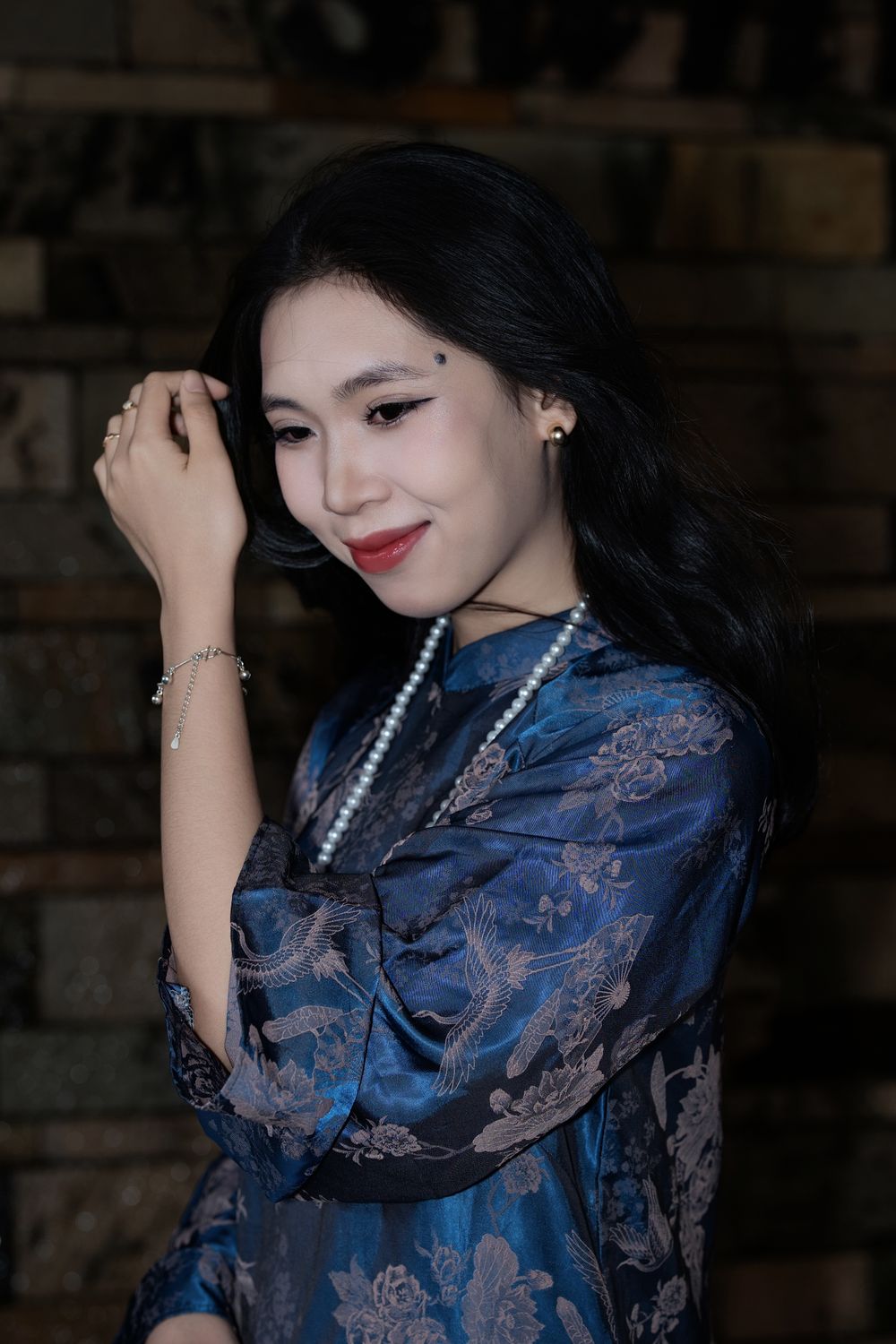 Elegant Woman in Blue Traditional Attire Indoors · Free Stock Photo