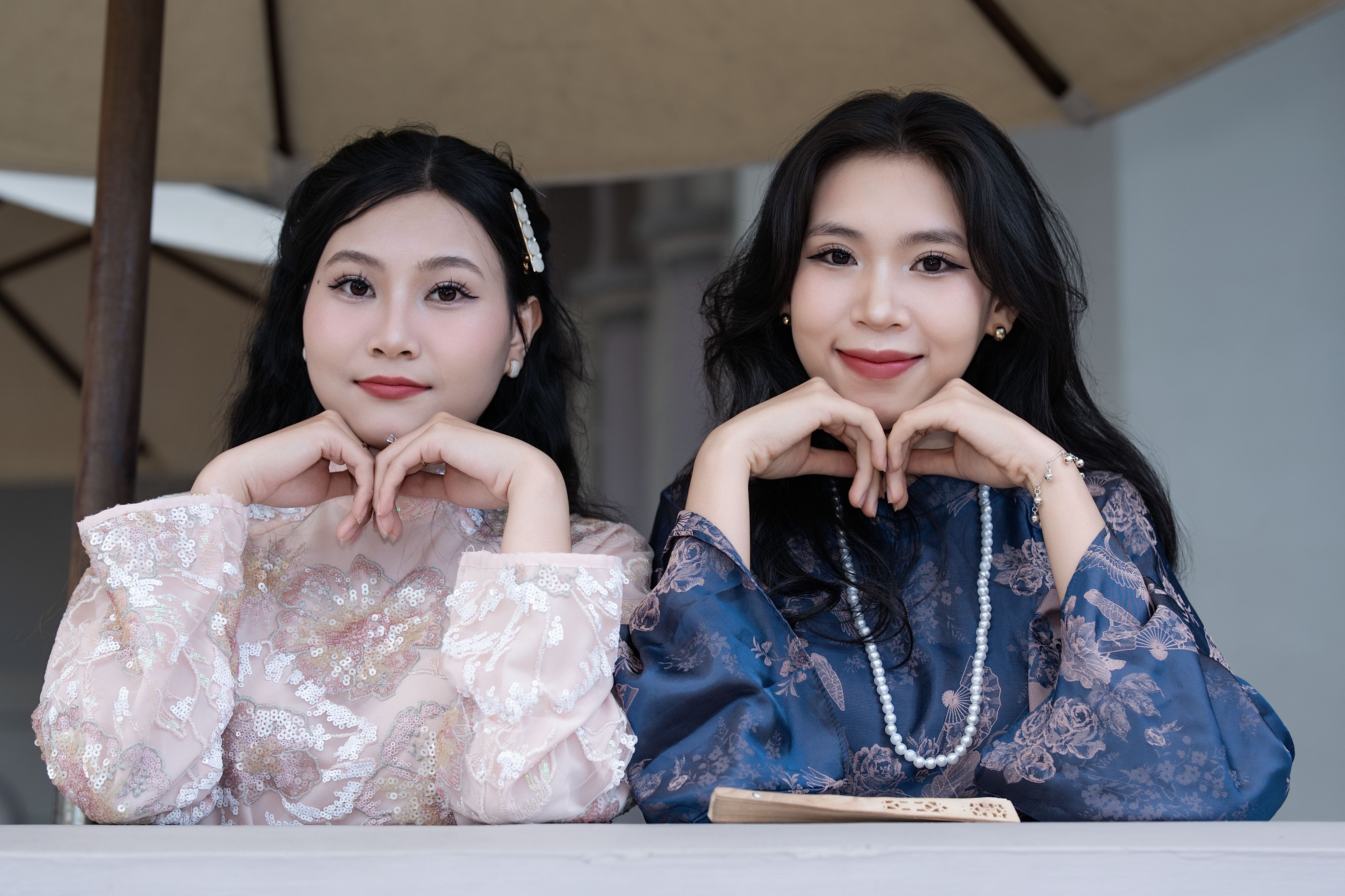 Elegant Portrait of Two Women in Traditional Attire · Free Stock Photo