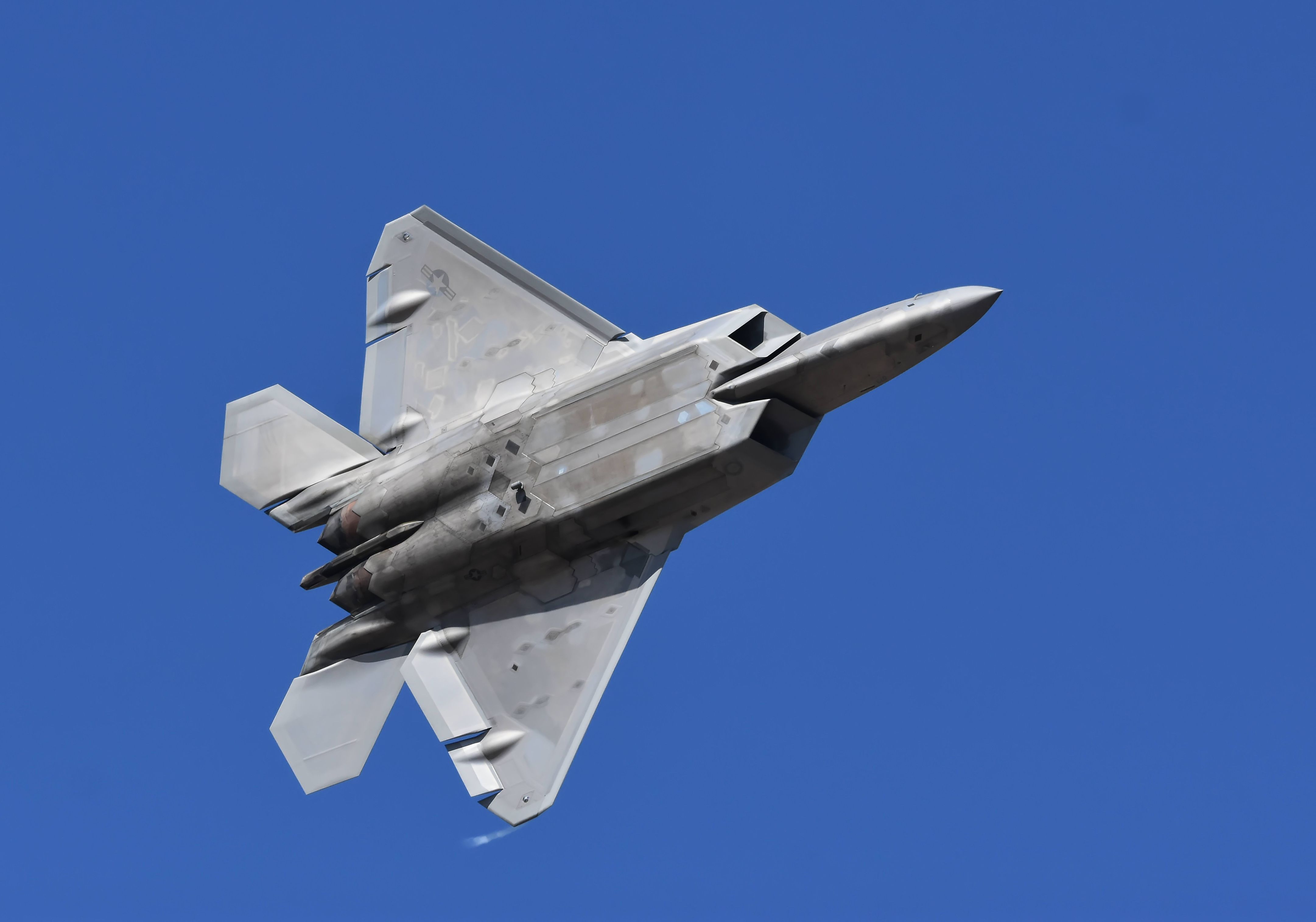 Military Jet Flying Vertically Against Blue Sky · Free Stock Photo