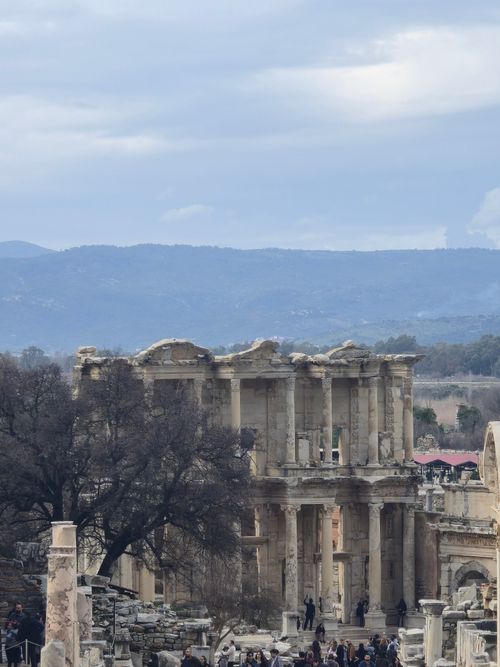 Free Explore the majestic ancient ruins of Ephesus, featuring the iconic Celsus Library under a cloudy sky. Stock Photo