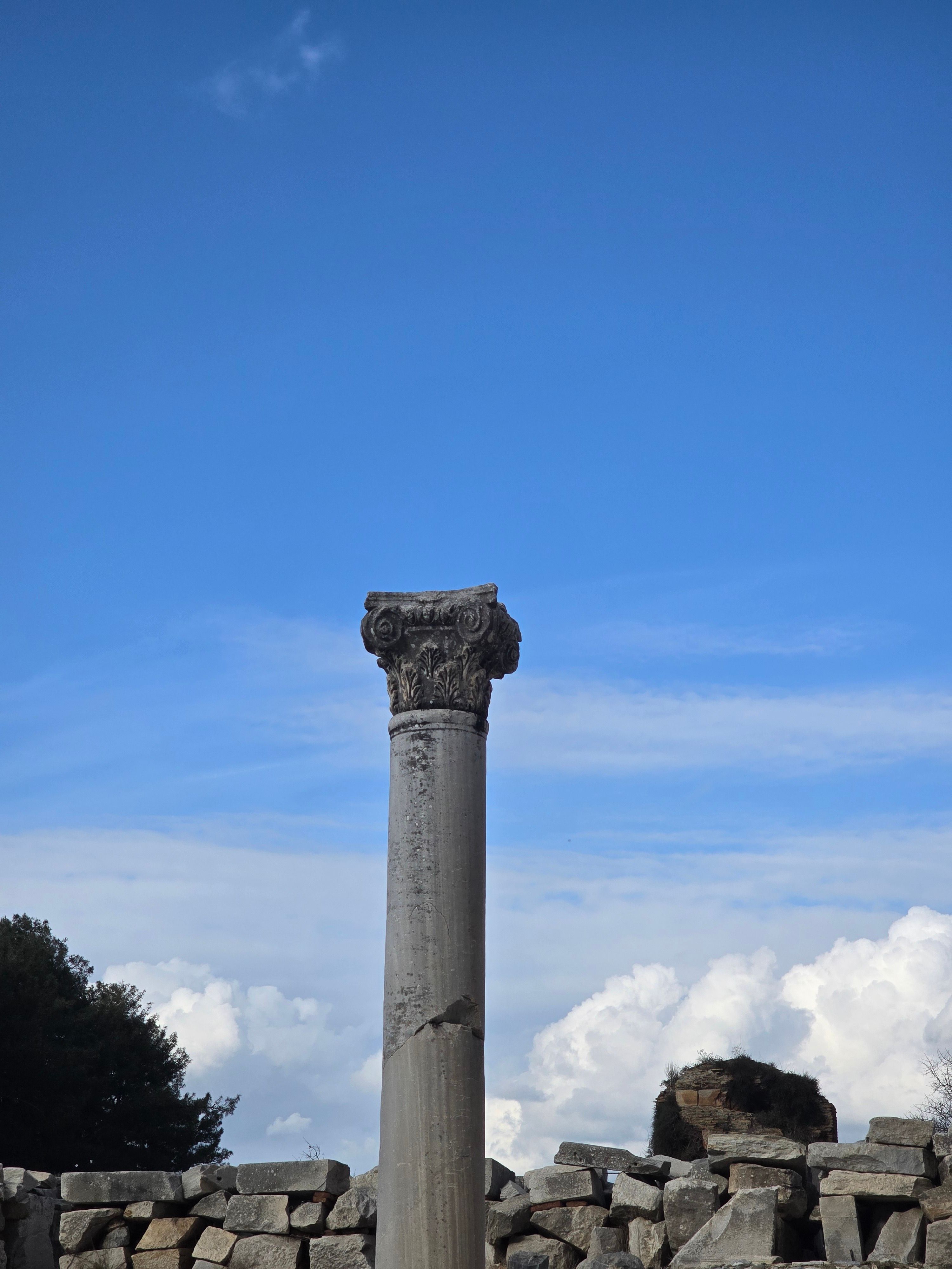 Ancient Roman Column in Ruins Under Blue Sky · Free Stock Photo