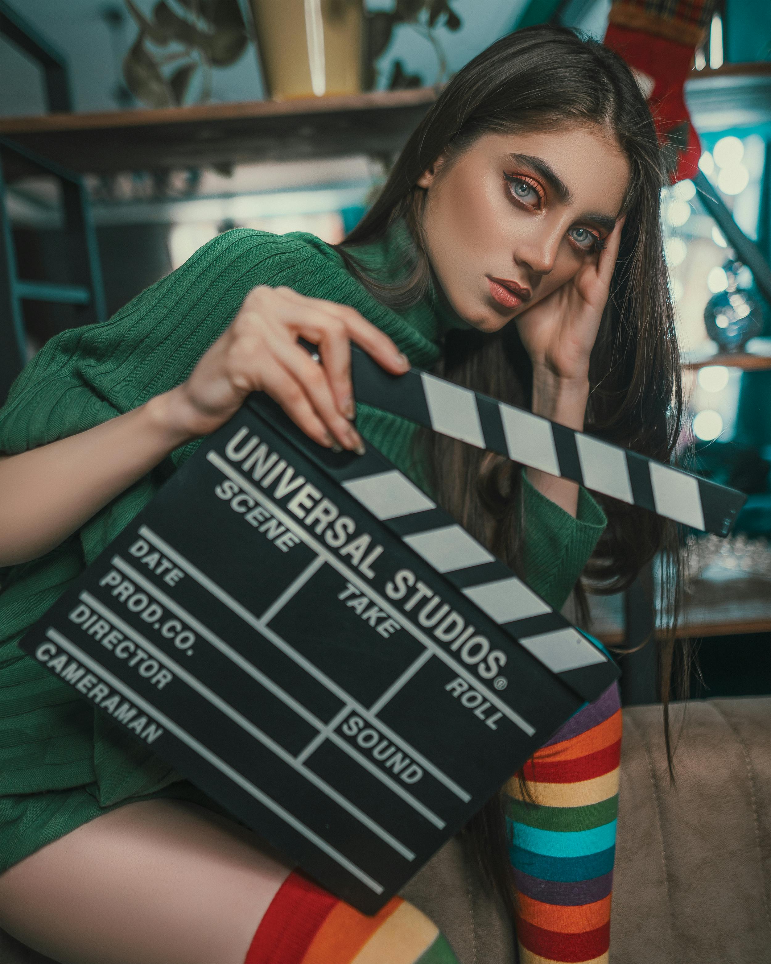 woman holding a clapperboard