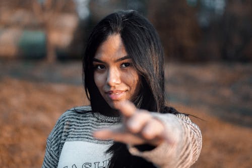 Free Woman Wearing Gray and White Long-sleeved Shirt Stock Photo