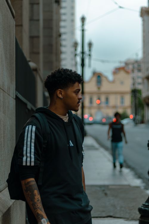 Free Young man in São Paulo street, capturing metropolitan life and style. Stock Photo