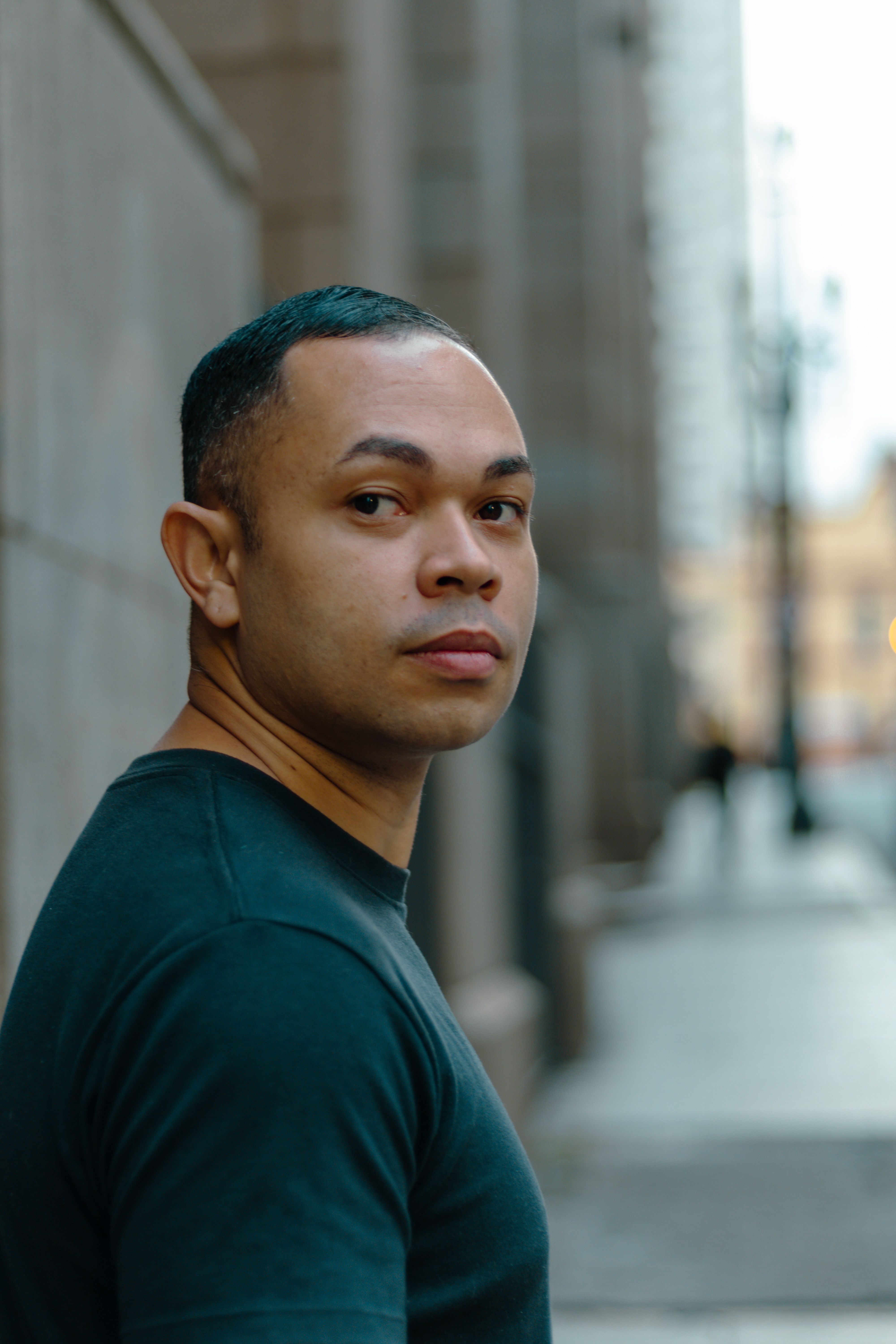 Close-up of a man in a city, reflecting urban lifestyle and diversity.