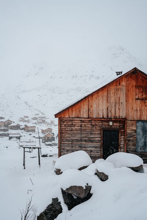 Rustic Cabin in Snowy Mountain Landscape · Free Stock Photo