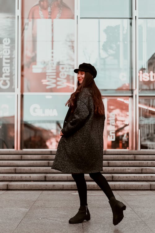 Woman Wearing Black Hat and Brown Coat