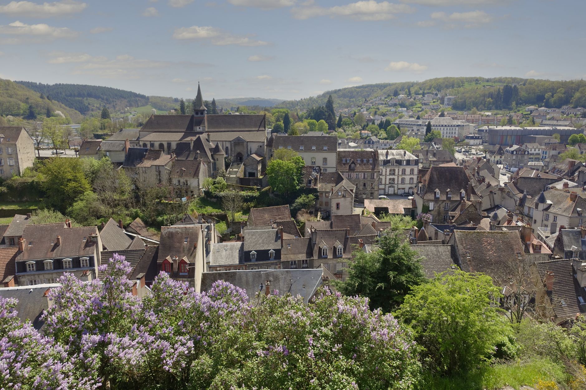 Scenic view of a charming French village with blooming flowers in springtime.