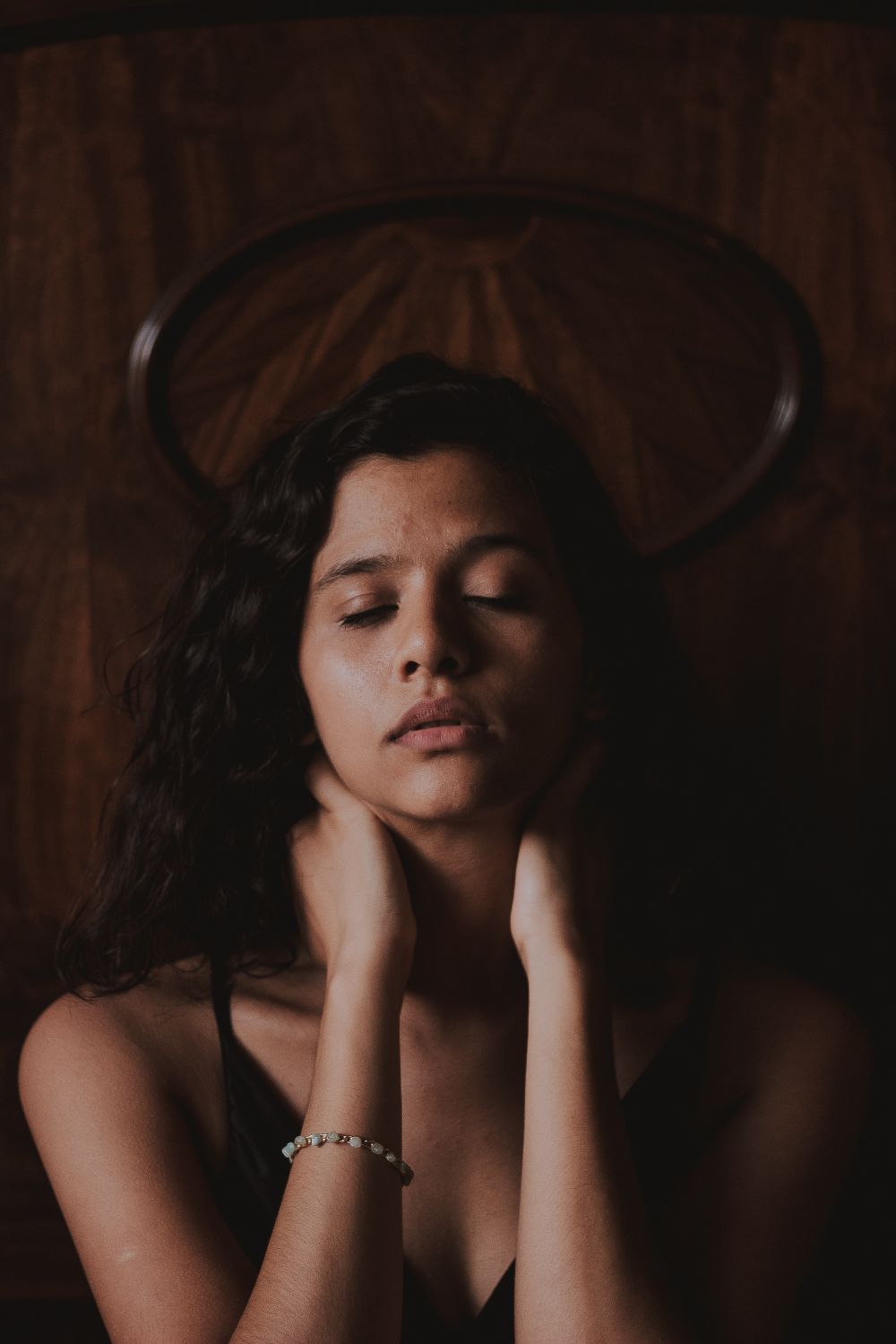 Woman Holding Her Neck While Eyes Closed · Free Stock Photo