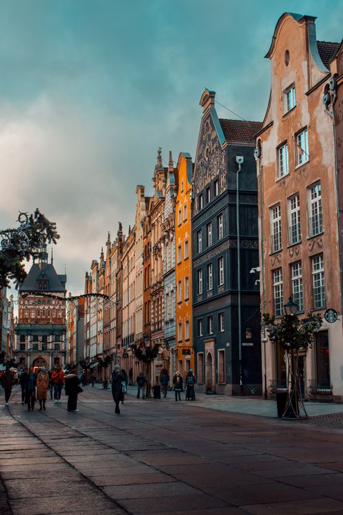 Free Vibrant architectural facades line a picturesque street in Gdańsk, Poland, capturing the essence of European history. Stock Photo