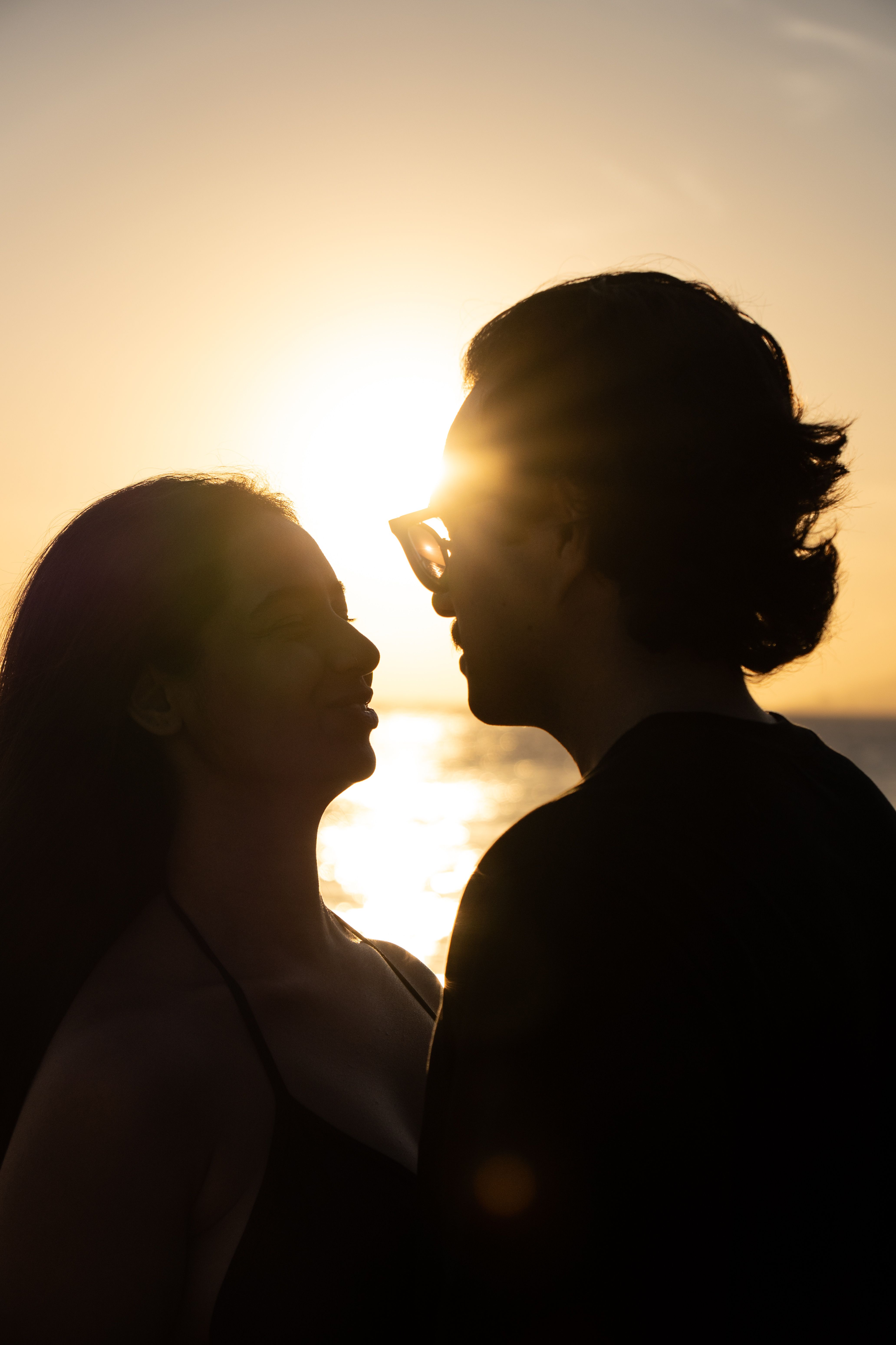 Silhouetted Romantic Couple at Sunset · Free Stock Photo