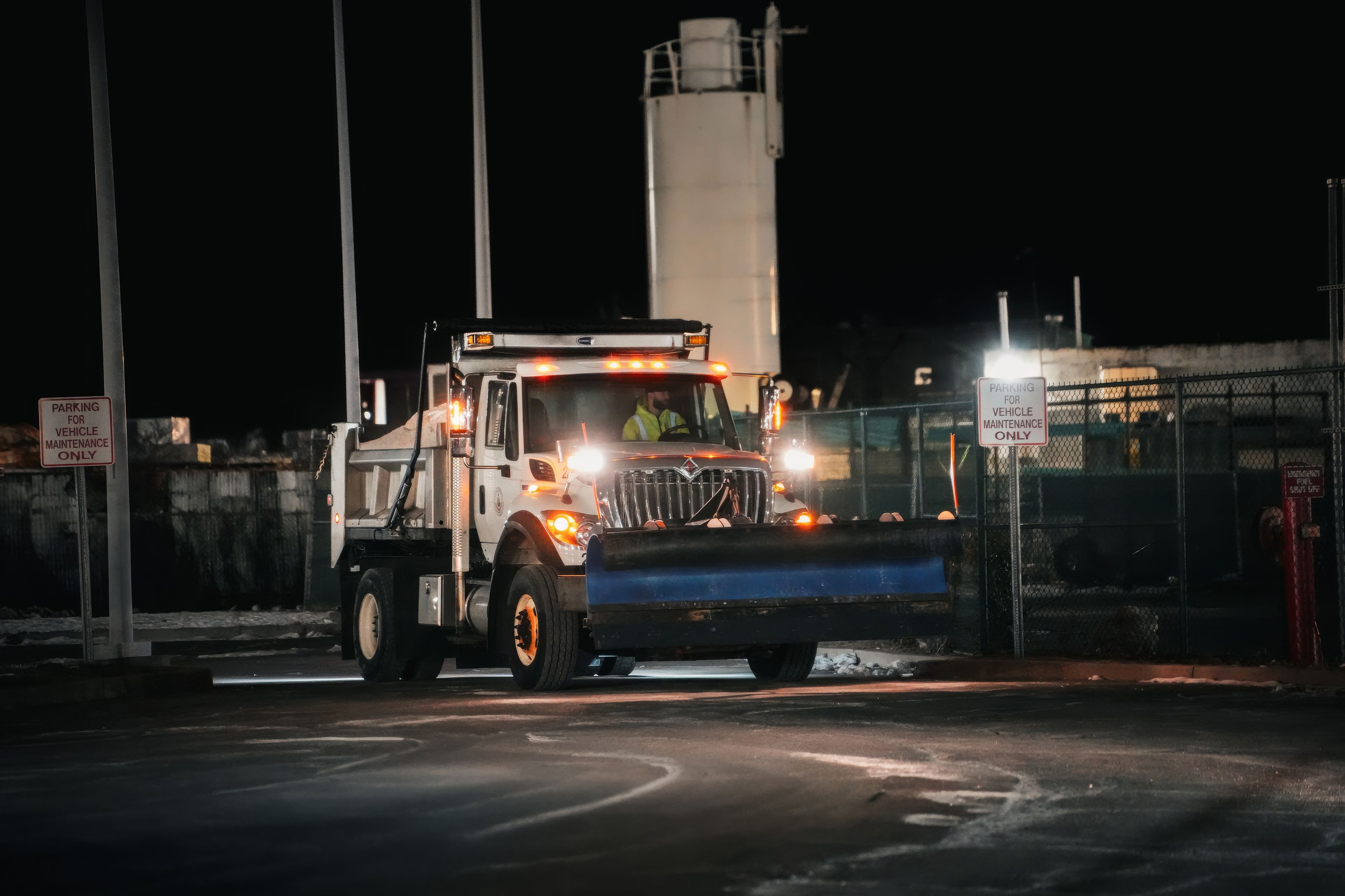 CE Electric service truck parked outside a Texas home at dusk with work lights on