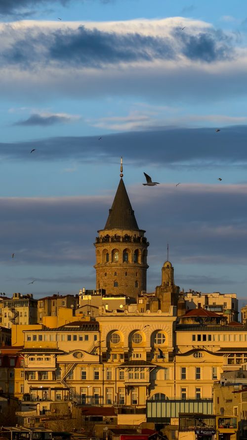 Free Beautiful view of Galata Tower with a backdrop of Istanbul's skyline, during a vibrant sunset. Stock Photo