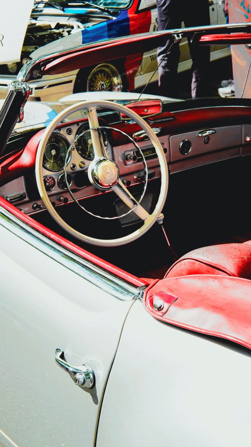 Free Classic convertible car interior featuring vintage design and red leather seats. Stock Photo