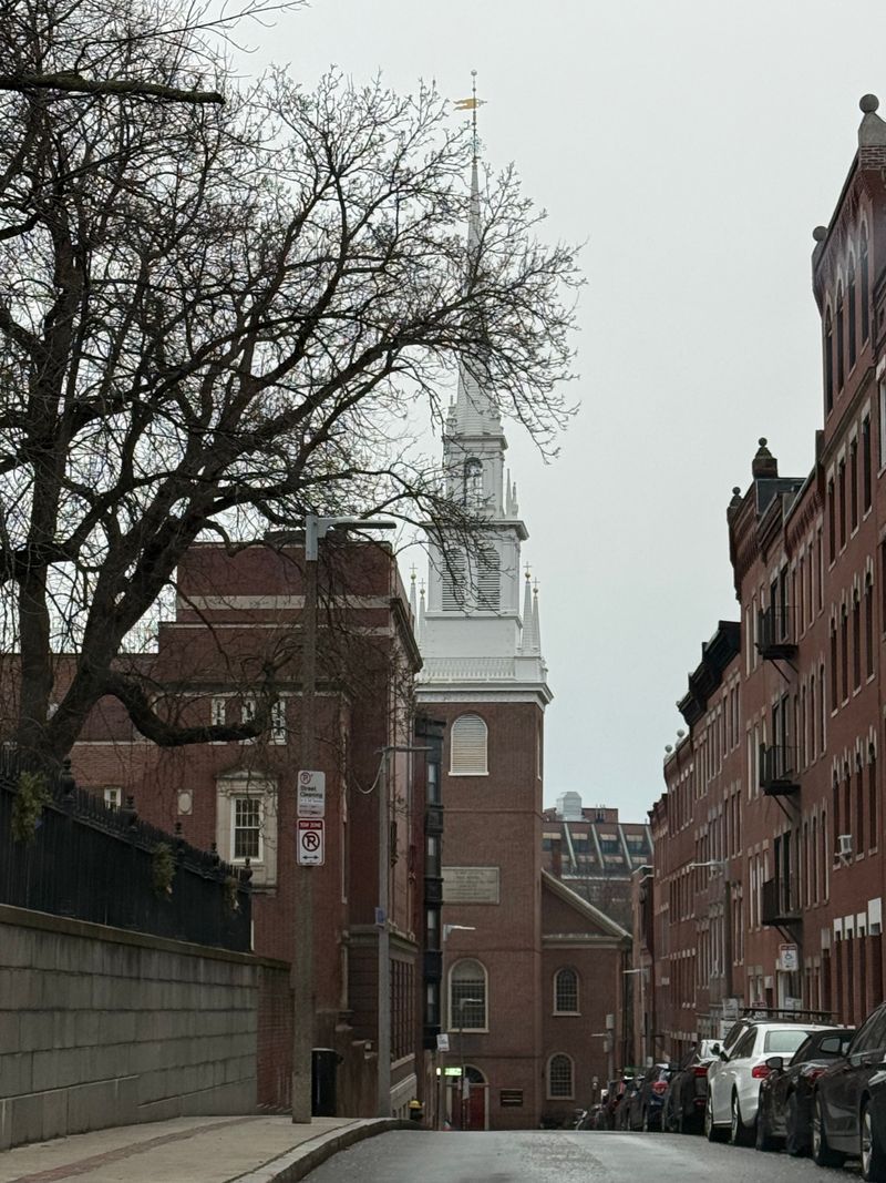 Old North Church steeple seen down a North End street in Boston