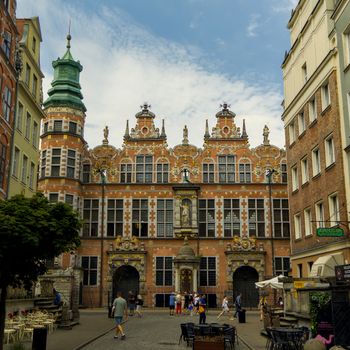 Explore the historic Artus Court in Gdańsk, showcasing stunning architecture and vibrant city life.