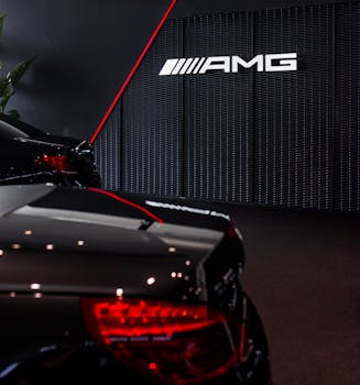 Luxury Mercedes AMG car in a sleek showroom setting, displaying elegance and speed.